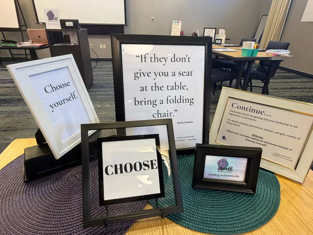 Framed Leading Authentically signs on a table: “Choose yourself,” “CHOOSE,” and a Shirley Chisholm quote